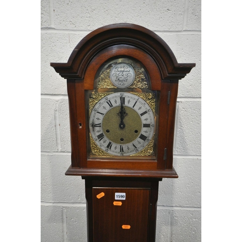 1590 - A 20TH CENTURY MAHOGANY CHIMING GRANDAUGHTER CLOCK, the arched door enclosing a brass and silvered 7... 