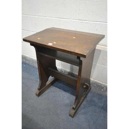 1591 - A 20TH CENTURY OAK CHILDS DESK, on trestle legs, united by a single stretcher, width 62cm x depth 44... 