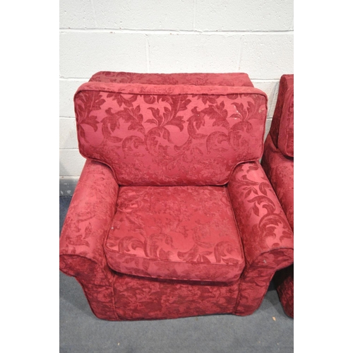 1593 - A BEIGE UPHOLSTERED TWO PIECE SUITE, comprising a two seater sofa and an armchair, both with red flo... 