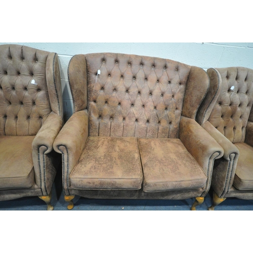 1594 - A FAUX LEATHER THREE PIECE LOUNCE SUITE, comprising a two seater sofa, and a pair of armchairs (cond... 