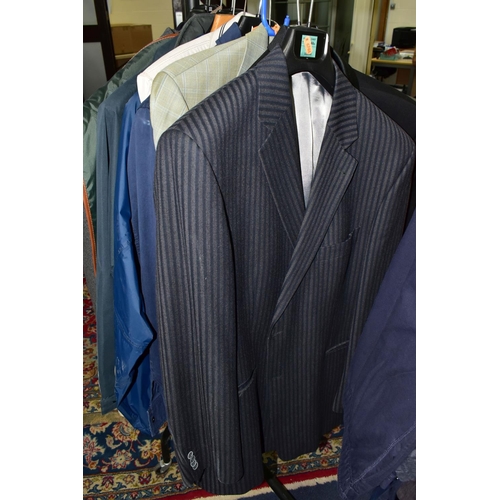 394 - A QUANTITY OF MEN'S CLOTHING, to include eleven jackets, blazers, overcoats, dinner suit (M&S), most... 