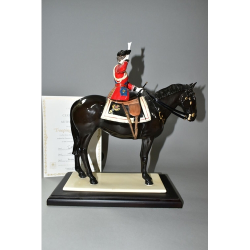 424 - A COALPORT LIMITED EDITION 'TROOPING THE COLOUR' FIGURINE, depicting Her Majesty The Queen on horseb... 