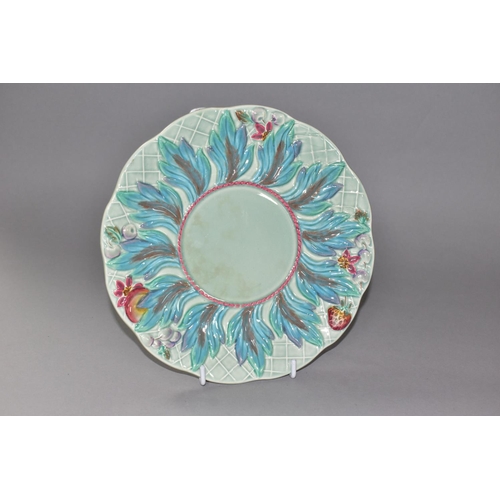 429 - A CLARICE CLIFF 'LEAVES AND BERRIES' PATTERN PLATE, with a painted, relief moulded, wide border of l... 