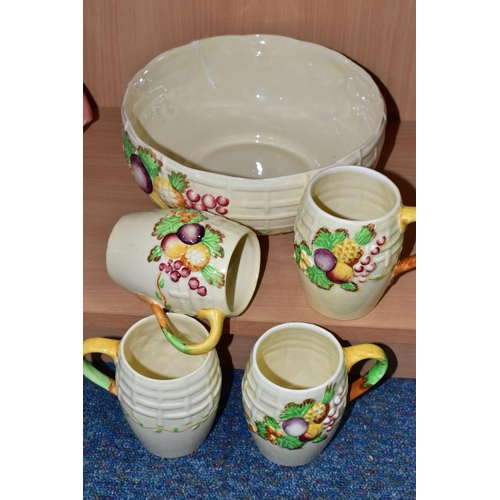 441 - A CLARICE CLIFF 'FRUIT BASKET' FRUIT BOWL AND FOUR MUGS, with relief moulded fruits and basketweave ... 