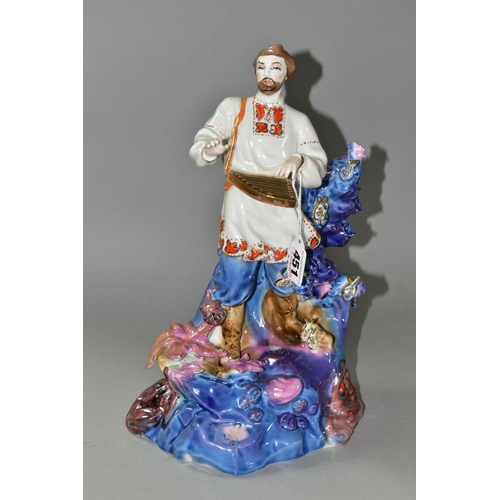 451 - A KIEV PORCELAIN FIGURE OF 'SADKO', a folk tale adventurer and musician, playing music to the Sea Ts... 