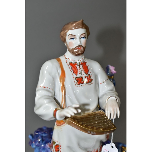 451 - A KIEV PORCELAIN FIGURE OF 'SADKO', a folk tale adventurer and musician, playing music to the Sea Ts... 