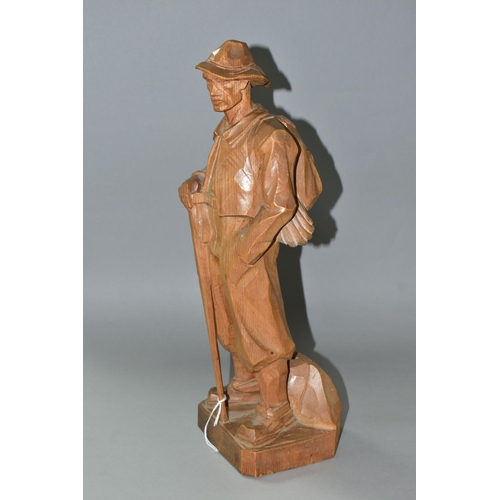 468 - A HAND CARVED PINE WOOD FIGURE, of a mountain climber, 'Paul Émile Caron' style, height 42cm (1) (Co... 