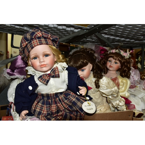 478 - A QUANTITY OF COLLECTABLE PORCELAIN DOLLS, to include over thirty dolls, some on stands, Angelic 'Br... 