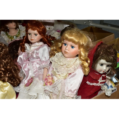 478 - A QUANTITY OF COLLECTABLE PORCELAIN DOLLS, to include over thirty dolls, some on stands, Angelic 'Br... 