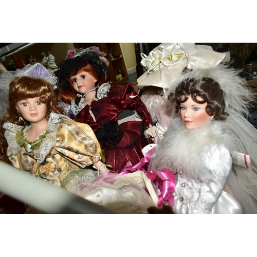 478 - A QUANTITY OF COLLECTABLE PORCELAIN DOLLS, to include over thirty dolls, some on stands, Angelic 'Br... 