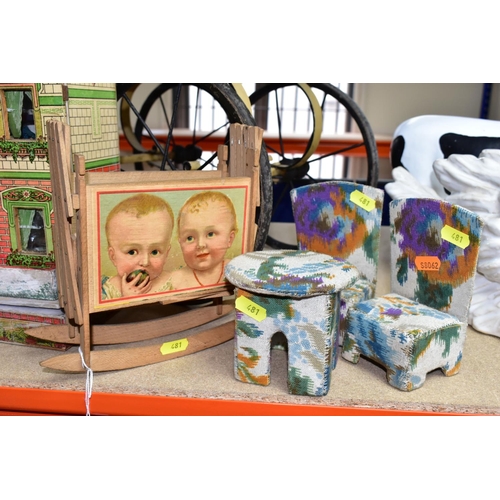 481 - A  CHILDS PRAM, the body is made of wood and painted cream, together with a small wooden doll's hous... 