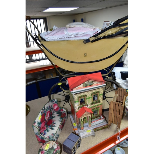 481 - A  CHILDS PRAM, the body is made of wood and painted cream, together with a small wooden doll's hous... 