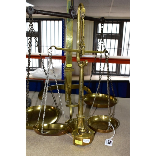 482 - TWO SETS OF VICTORIAN BRASS SCALES, comprising one set with chains and pans on a brass stand, height... 