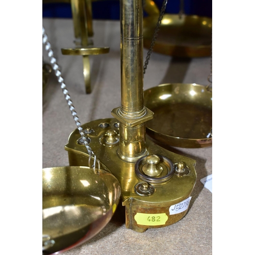 482 - TWO SETS OF VICTORIAN BRASS SCALES, comprising one set with chains and pans on a brass stand, height... 