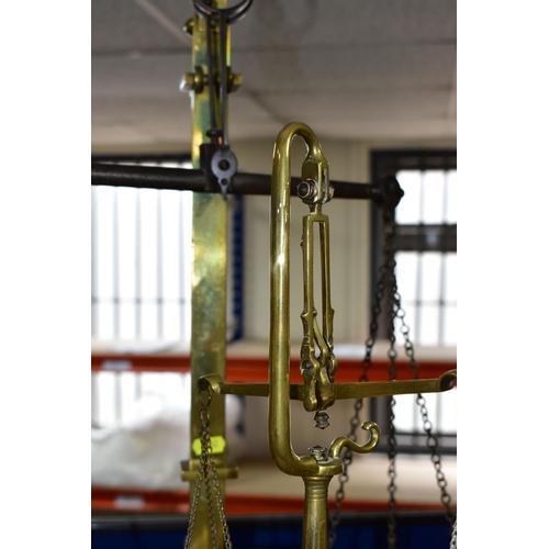 482 - TWO SETS OF VICTORIAN BRASS SCALES, comprising one set with chains and pans on a brass stand, height... 