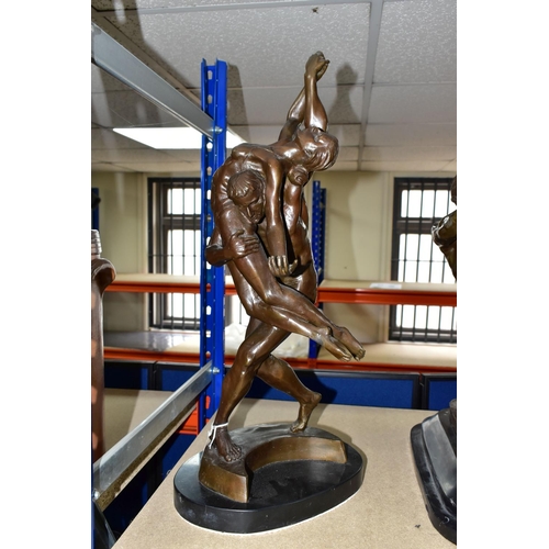 484 - A MODERN BRONZE SCULPTURE, of a man and woman in a dance pose, the male figure is attempting to lift... 