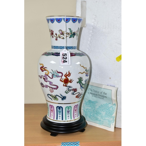 524 - AN ORIENTAL INSPIRED FRANKLIN MINT PORCELAIN VASE, titled 'The Dance of the Celestial Dragon', on a ... 