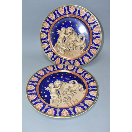 527 - TWO ROSENTHAL FOR VERSACE CHRISTMASTIDE 2000 PLATES, depicting a cherub, lion and cornucopia statue ... 