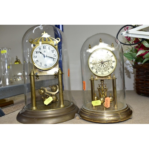 555 - TWO GLASS DOMED CLOCKS, comprising a  West German 400 day anniversary clock 'Kieninger & Obergfell' ... 