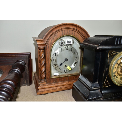 565 - A COLLECTION OF FIVE CLOCKS, to include a late 19th century black slate mantel clock, made by Ansoni... 