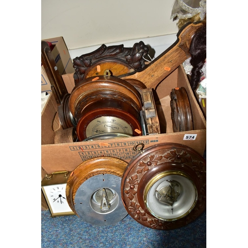 574 - TWO BOXES OF SPARE PARTS FOR BAROMETERS AND CLOCKS,  to include brass frames, faces, glass fronts an... 