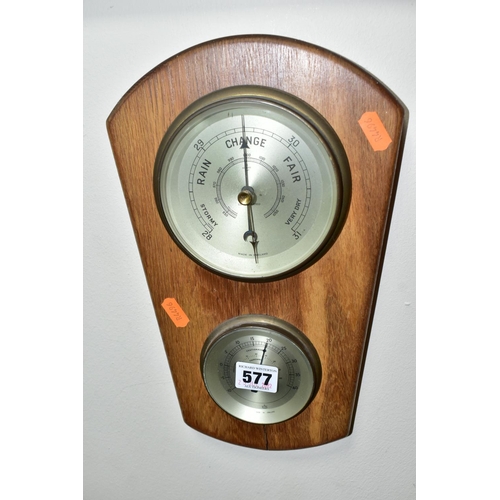 577 - A BAROMETER AND FOUR LOOSE ITEMS, including a collectable wall plate 'Dedham Mill', two framed displ... 