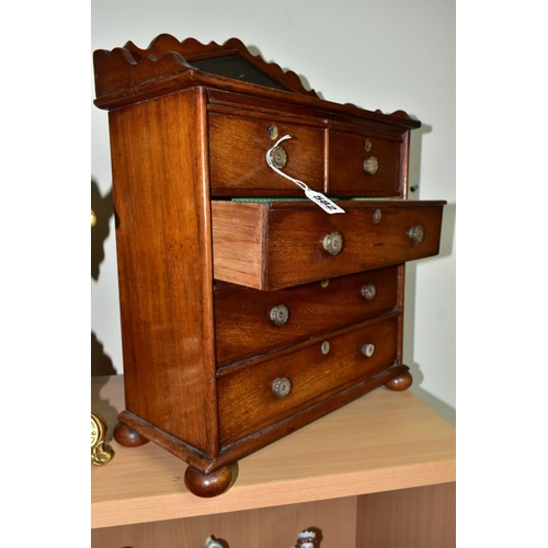 582 - A MINIATURE MAHOGANY CHEST OF DRAWS WITH GALLERIED MIRROR, having two short draws over three long dr... 