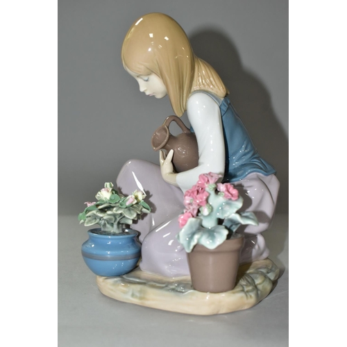 591 - LLADRO FIGURINE 'WATERING THE FLOWER POTS', a young girl is holding a pitcher of water to water plan... 