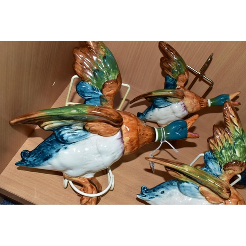 602 - THREE BESWICK FLYING DUCKS, sizes 596-1, 596-2 and 596-3, some crazing to the glaze with white paint... 