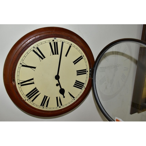 609 - AN EARLY 20TH CENTURY CIRCULAR WALL CLOCK, 'train station style' with pendulum and key, Roman numera... 