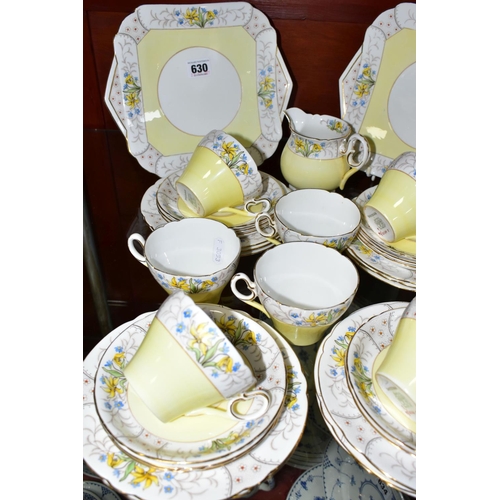 630 - A THIRTY THREE PIECE SHELLEY CAMBRIDGE SHAPE PART TEA SET IN PATTERN 12995/56, featuring borders of ... 