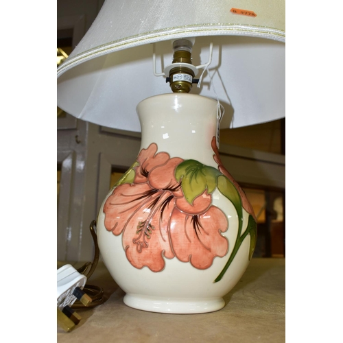 648 - A MOORCROFT POTTERY TABLE LAMP BASE DECORATED WITH A CORAL 'HIBISCUS' DESIGN ON A CREAM BACKGROUND, ... 