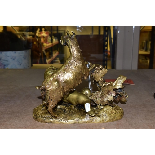 654 - A GILT BRONZE FIGURINE OF  A CHERUB, a reclining Cherub and a goat next to a grapevine, height 24cm ... 