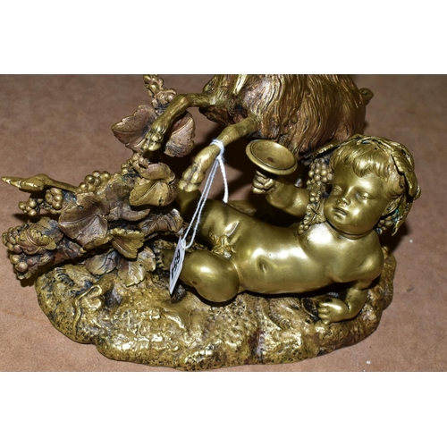 654 - A GILT BRONZE FIGURINE OF  A CHERUB, a reclining Cherub and a goat next to a grapevine, height 24cm ... 