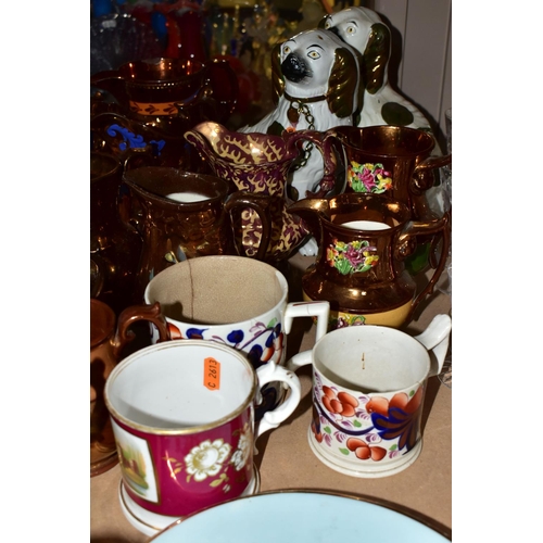 657 - A GROUP OF VICTORIAN STAFFORDSHIRE COPPER LUSTRE WARE, to include twelve jugs some with three blue l... 