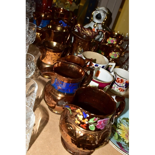 657 - A GROUP OF VICTORIAN STAFFORDSHIRE COPPER LUSTRE WARE, to include twelve jugs some with three blue l... 