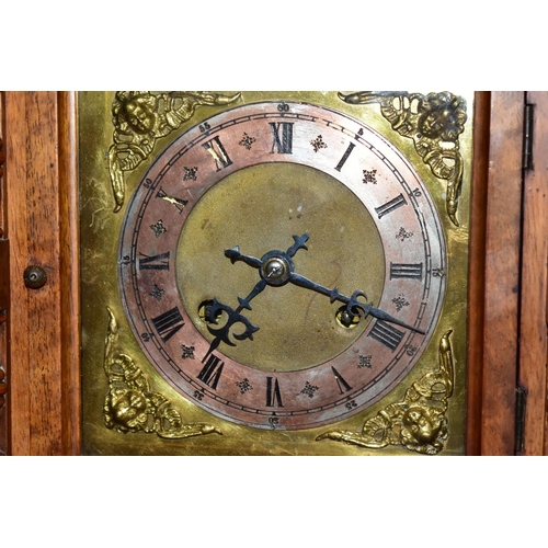 667 - A WALNUT CASED CHIMING  MANTLE CLOCK, possibly with a replacement dial and movement, the silvered ch... 