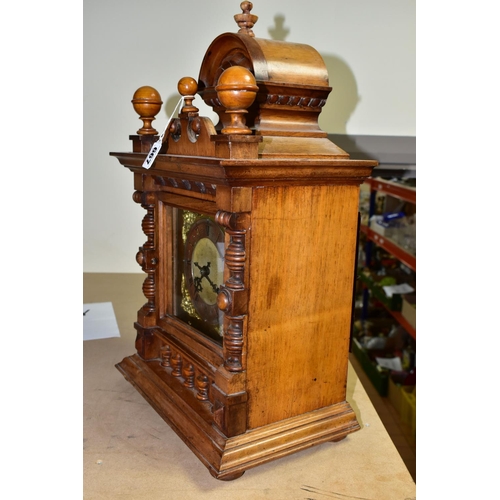 667 - A WALNUT CASED CHIMING  MANTLE CLOCK, possibly with a replacement dial and movement, the silvered ch... 