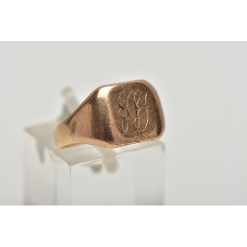 13 - A YELLOW METAL SIGNET RING, square polished signet with worn engraved initials, tapered polished sho... 