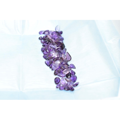 61 - AN ASSORTMENT OF LOOSE AMETHYST, a selection of vary cut small stones, some stones are damaged with ... 