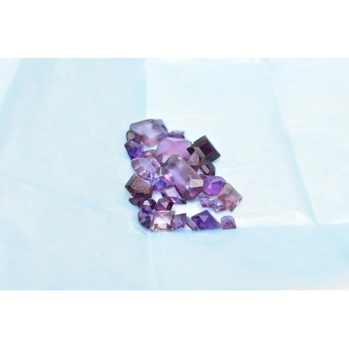 61 - AN ASSORTMENT OF LOOSE AMETHYST, a selection of vary cut small stones, some stones are damaged with ... 