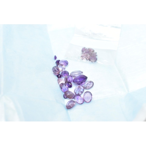 61 - AN ASSORTMENT OF LOOSE AMETHYST, a selection of vary cut small stones, some stones are damaged with ... 