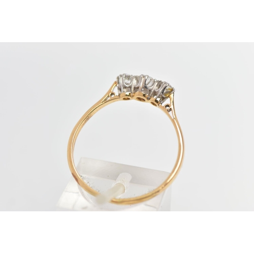 78 - A MID 20TH CENTURY PLATINUM AND 18CT YELLOW GOLD DIAMOND THREE STONE RING, set with a principal roun... 