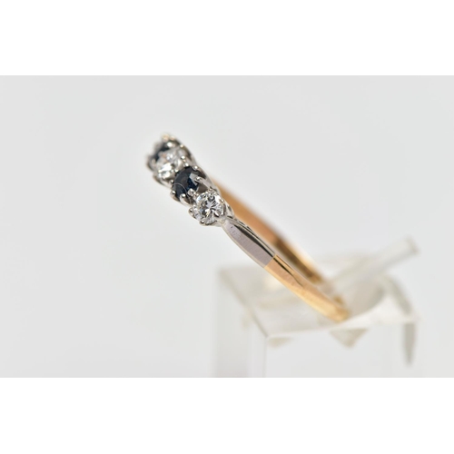 79 - A YELLOW AND WHITE METAL DIAMOND AND SAPPHIRE FIVE STONE RING, set with three graduating round brill... 