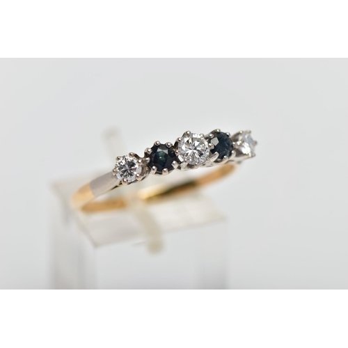 79 - A YELLOW AND WHITE METAL DIAMOND AND SAPPHIRE FIVE STONE RING, set with three graduating round brill... 