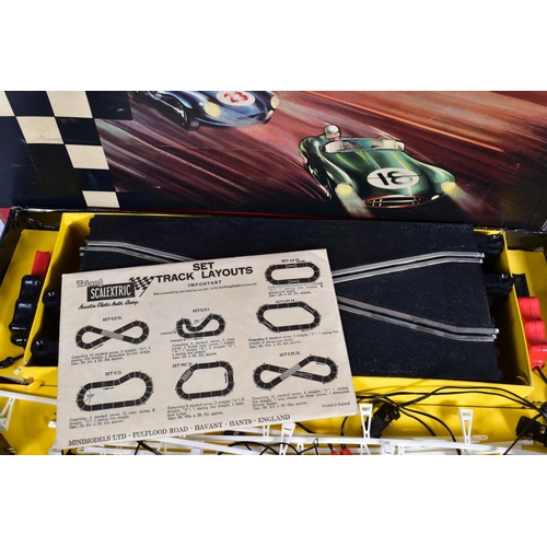 10 - A BOXED SCALEXTRIC COMPETITION CAR SERIES WITH LIGHTS SET, No.CM.34, complete with both cars, Aston ... 