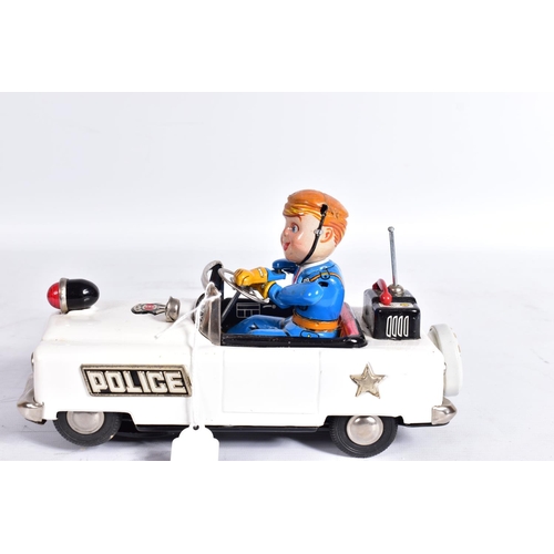 77 - A BOXED NOMURA (TN TOYS) TINPLATE BATTERY OPERATED  MYSTERY POLICE CAR, not tested, appears largely ... 