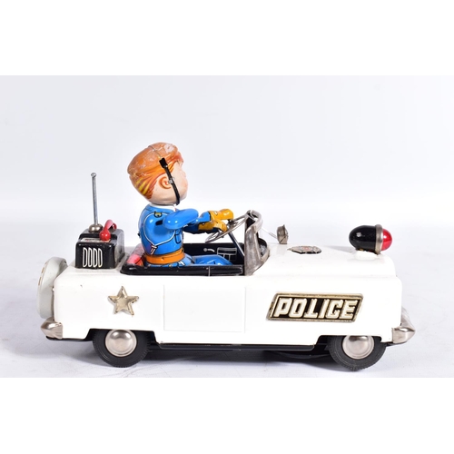 77 - A BOXED NOMURA (TN TOYS) TINPLATE BATTERY OPERATED  MYSTERY POLICE CAR, not tested, appears largely ... 