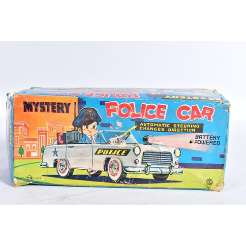 77 - A BOXED NOMURA (TN TOYS) TINPLATE BATTERY OPERATED  MYSTERY POLICE CAR, not tested, appears largely ... 