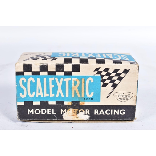 9 - A BOXED SCALEXTRIC MINI COOPER, No.C76, green with RN8, complete with driver and in good condition w... 